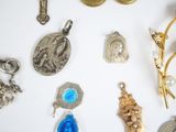 many different types of jewelry on a white surface