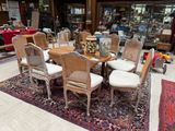 many chairs and a table in the middle of a room