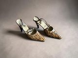 an image of a pair of women ' s shoes on a gray surface