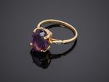 an amethorate and diamond ring set in yellow gold