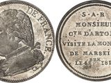 a silver coin with a portrait of a man on it