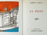 an open book with a picture of a castle on it