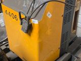 a yellow and black box sitting on top of a pallet