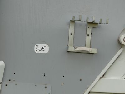a close up of a metal door with a number on it