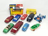 many different toy cars and a boat in a box
