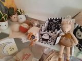 several stuffed animals are sitting on a shelf next to other stuffed animals