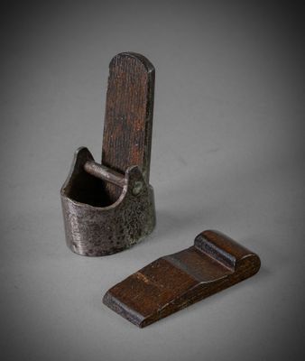 a small piece of wood that is next to a small piece of wood