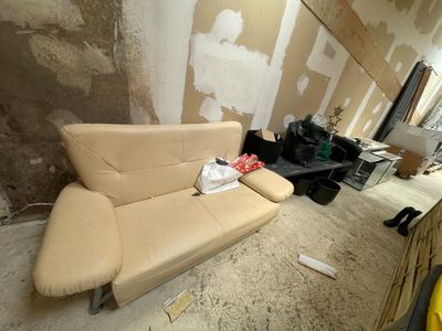 a couch that is sitting in the middle of a room