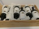six bottles of wine in a wooden box