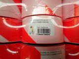 several rolls of red and white candy canes stacked on top of each other