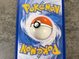 a close up of a pokemon card on a table