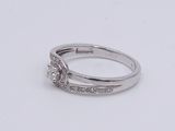 a picture of a diamond ring on a white surface