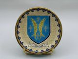 an image of a plate with a coat of arms on it
