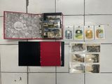 a red and black book with pictures on it on a tiled floor