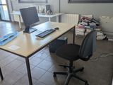 a desk with a computer and a keyboard on it