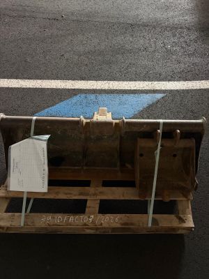 a pallet with a piece of wood on it on the street