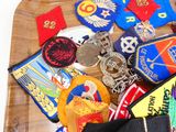 many different types of badges on a wooden board