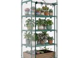 an image of a green house with plants on top of it