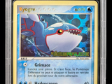 a close up of a pokemon card with a shark on it