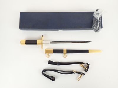 a close up of a knife and other items on a white surface