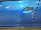 a close up of a blue car door with a sticker on it