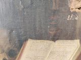 a painting of an open book on a table next to a skull