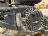 a close up of a motorcycle with a blower attached to it