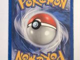 a pokemon card with a red and white ball on it