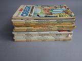 several children ' s books stacked on top of each other on a table
