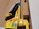 a box with a broom and a broom brush in it