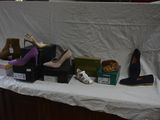 several pairs of women ' s shoes are on display on a table