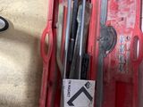 a red tool box with tools in it on the floor