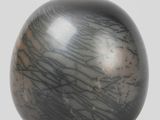 an image of a black and white vase on a white surface