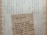an old book with a piece of paper on top of it