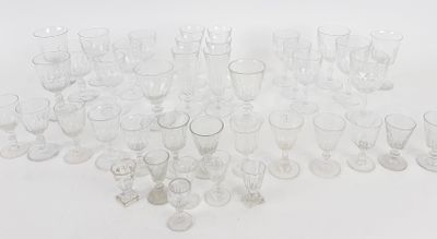 a lot of empty glasses on a white surface