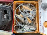 many different tools in a box on the floor
