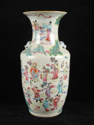 a vase with a painting on it sitting on a black surface
