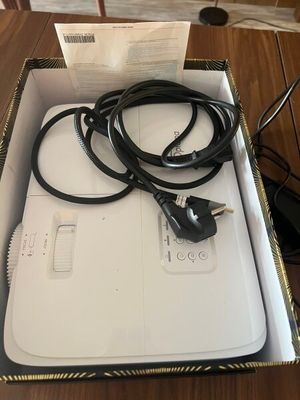a box that has a charger and a cord in it