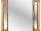 un miroir encadré d'or sur fond blanc