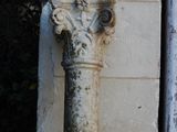 a stone column on the side of a building