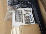 a box with a bunch of screws and nuts in it