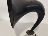 a silver and black horn on a silver stand