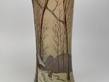 a vase that has a picture of a bird on it