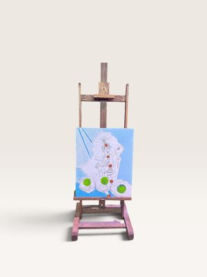 un petit chevalet sur lequel est posé un tableau représentant un chat