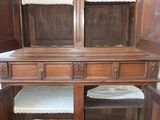 an old wooden cabinet with two open doors on it
