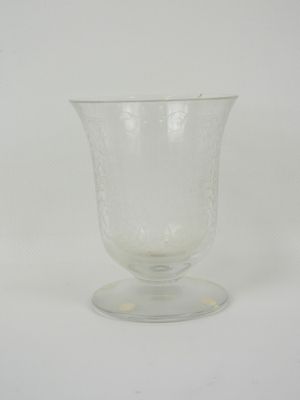 clear glass wine goblet sitting on a white surface