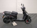 an image of a scooter parked on a checkered floor