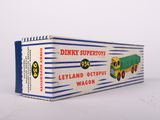 a box with a toy truck on it on a white surface