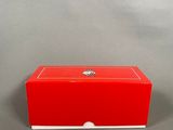 an image of a red box with a white lid on a gray background