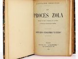 an open book on a white surface with a picture of the title in it